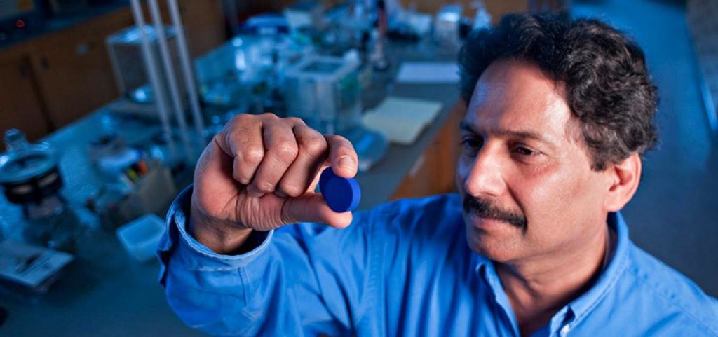 Mas Subramanian holding the pigment he discovered. Credit: Oregon State University